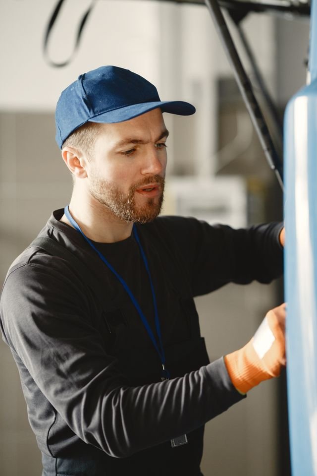 AC repair technician servicing outdoor unit in Pflugerville